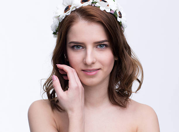 istock woman with wreath looking at camera 467011984