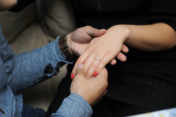 istock just engaged couple holding hands at restaurant 467012678