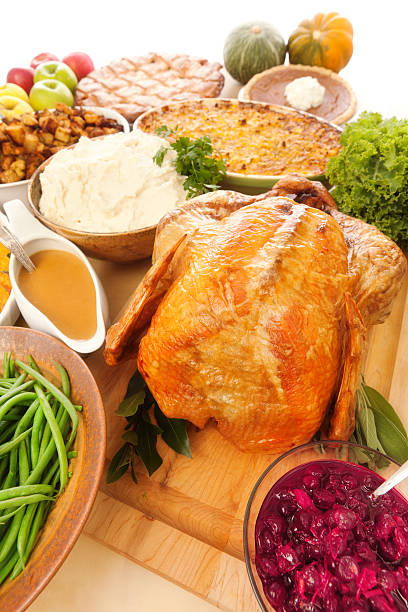 istock Thanksgiving Dinner Complete with Roasted Turkey and Trimmings Vertical 467014057