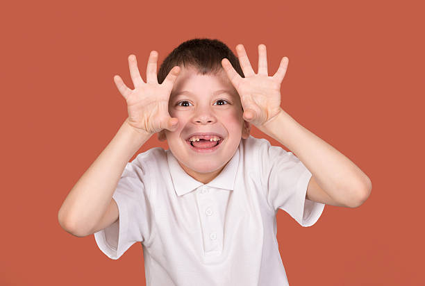 istock boy portrait in white shirt on brown 467016501
