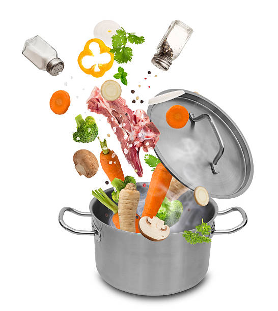 istock Fresh vegetables falling into stainless steel pot 467016758