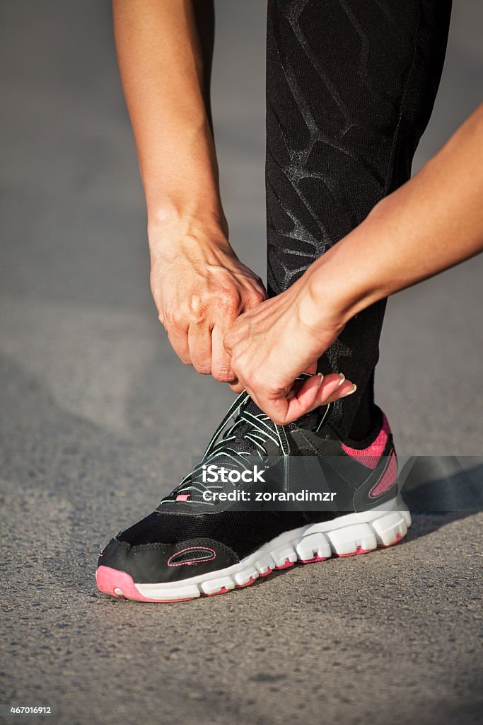 Runner tying sport shoes 2015 Stock Photo