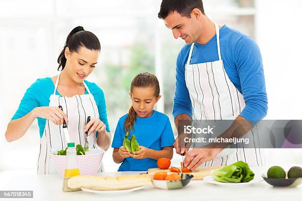 Lovely Family Preparing Food At Home Stock Photo - Download Image Now - Adult, Apron, Beautiful People