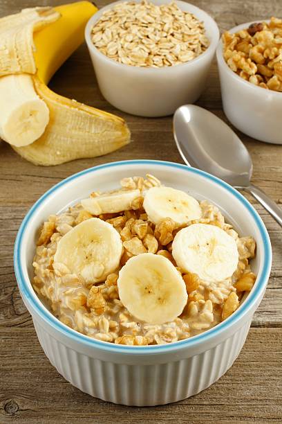istock Banana walnut oatmeal on wood table 467020624