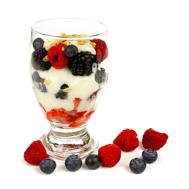 istock Mixed berry, granola and yogurt parfait over white 467021282