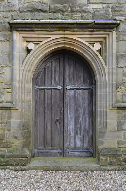 istock Arched doorway with oak wood door. 467022051