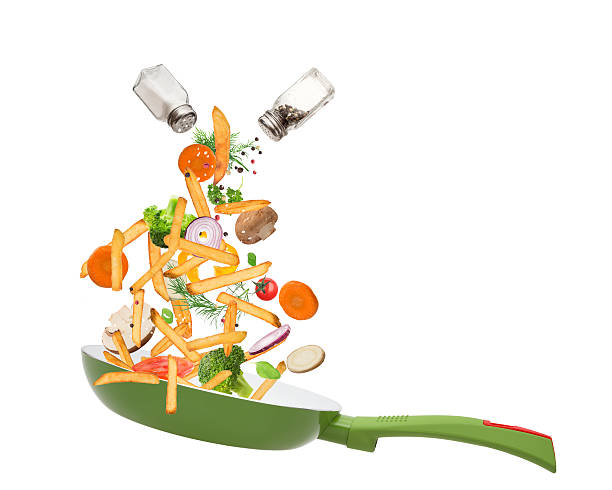 istock Pan with vegetables in freeze motion 467024762