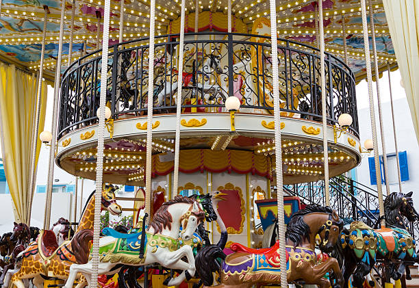 A hundred-year-old fairground galloper roundabout at a fair.