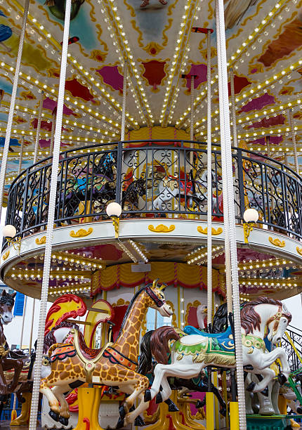 istock Merry go round in carnival vertical 467030079
