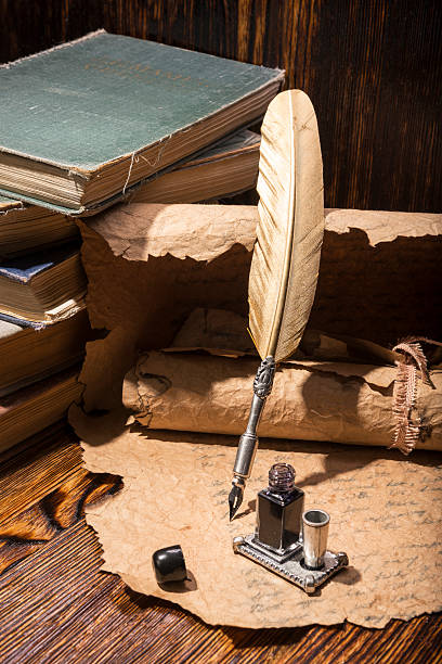 istock Vintage golden pen and ancient manuscripts 467032092
