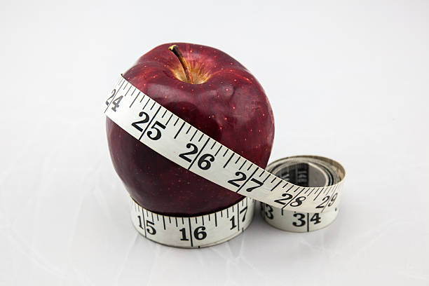 istock Red Apple with Measure Tape 467033388
