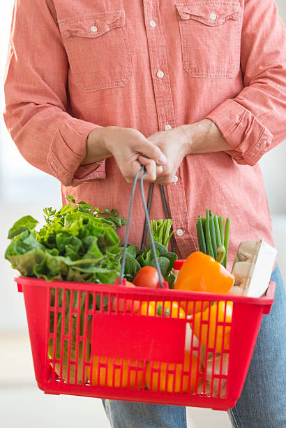 istock Man Carrying Basket Full Of Vegetables 467033843
