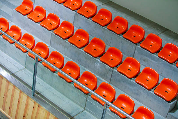 istock Closeup red stadium seats. Empty stand. Team sport supporter 467034885
