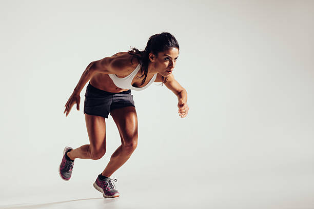 istock Energetic young woman running 467037464