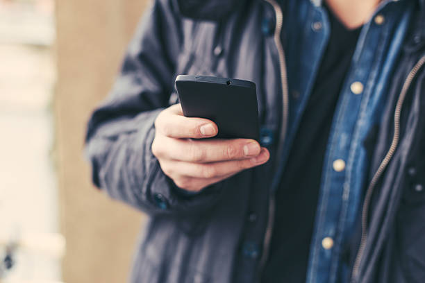istock Close up of a man using mobile smart phone 467040366