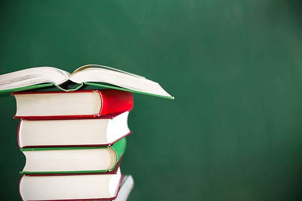 istock Back to school:Green apple sitting on education books 467041366