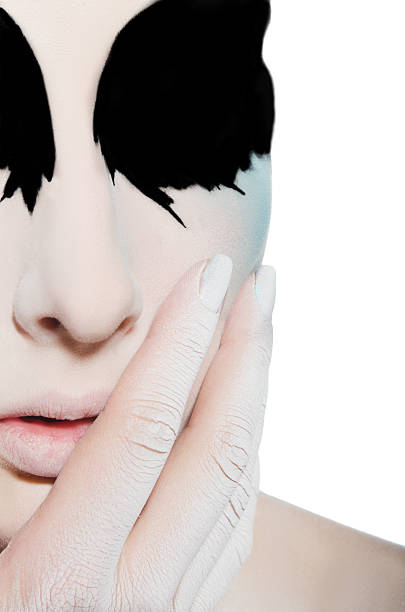 istock face and hand of woman with black white makeup 467043802