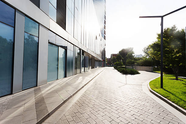 istock modern office building exterior and road 467044076