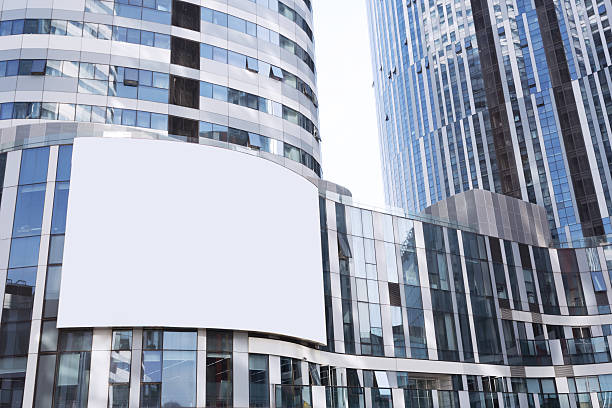istock Empty billboard on futuristic office building exterior 467044404