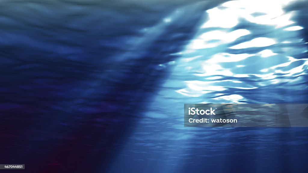 Light breaking through the surface of the ocean Light in the sea Blue Stock Photo