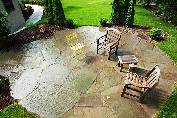 istock Landscaped Stone Patio Back Yard with Side Table and Chairs 467046533
