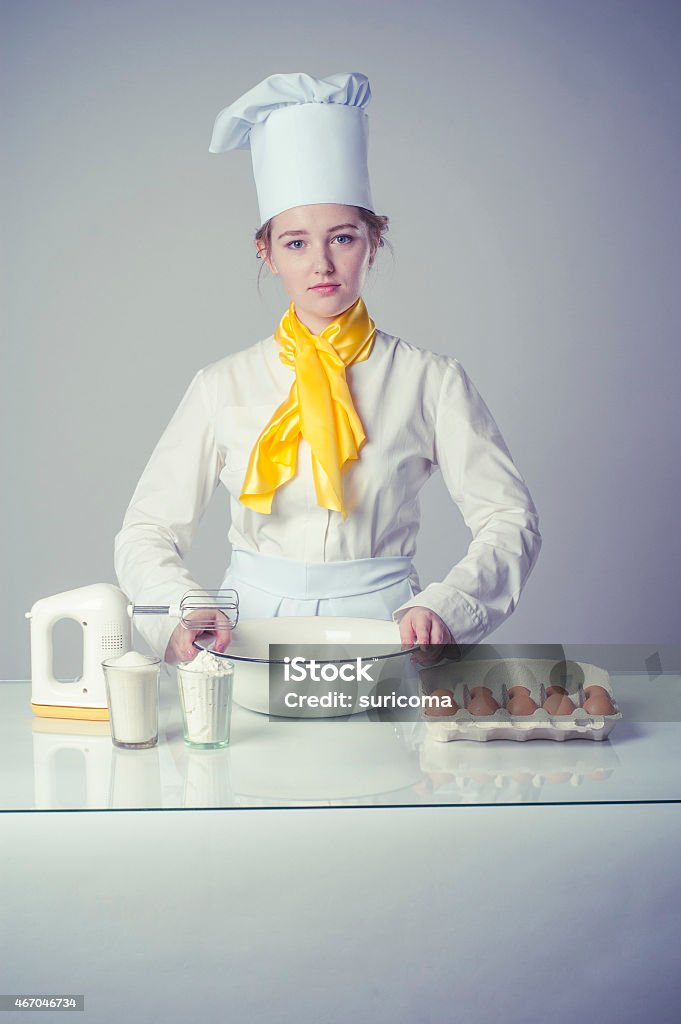 cook in kitchen Photo of a serious cook in kitchen 2015 Stock Photo