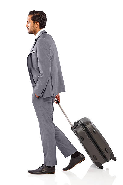 istock Young Indian businessman walking with suitcase 467052131