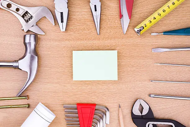construction:Work Tools and blank note on wood