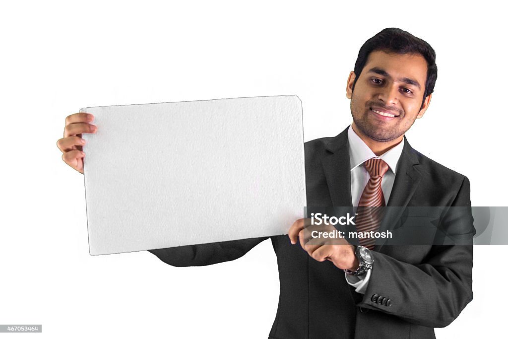 Young business man showing black placard Isolated on white 2015 Stock Photo