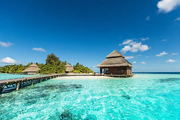 small tropical island with beach villas