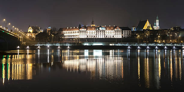 istock Panoramic view of Warsaw waterfront by night. 467054446