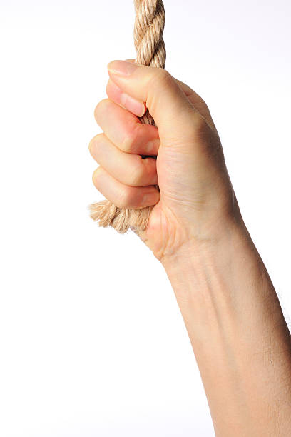 istock End of the rope with hand against white background 467057013