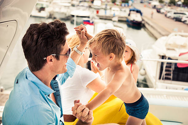 istock Happy young family and sons playing together 467062294