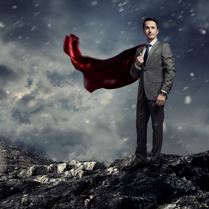Businessman wearing a red cape. Success concept.