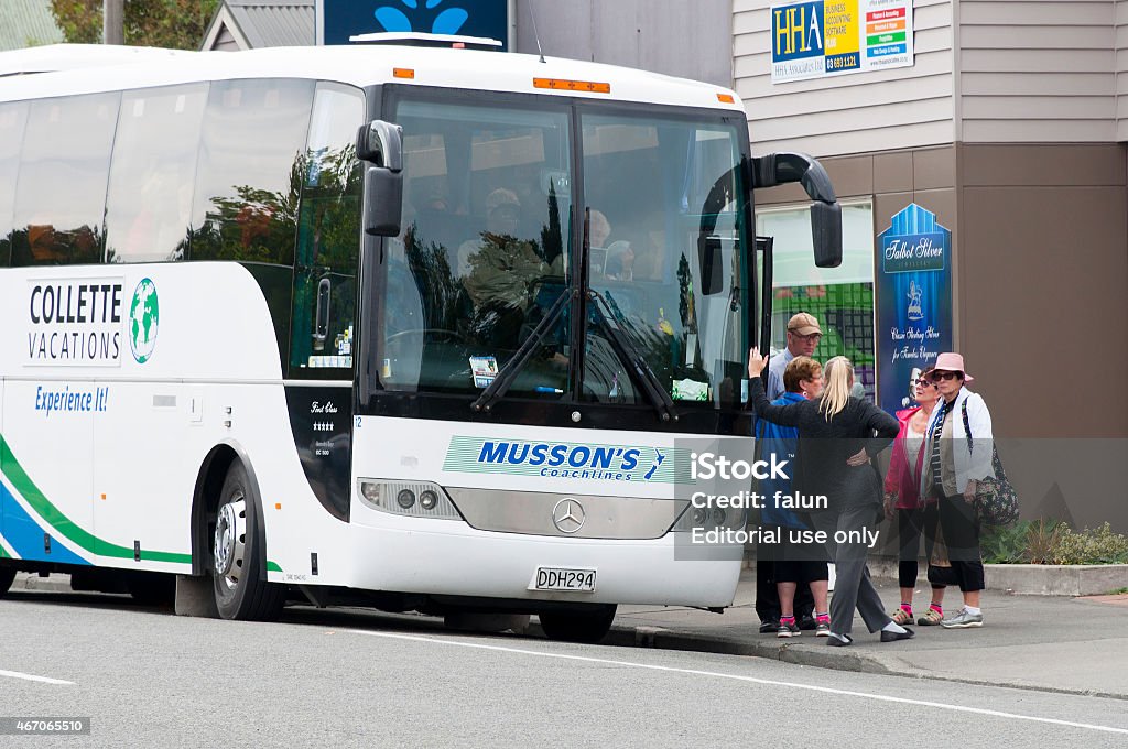 Tourist bus Geraldine,New Zealand - february 28,2015: The Bus is parked in the street in Geraldine. Tourists waiting for the bus to go ahead to the next attraction. Bus Stock Photo