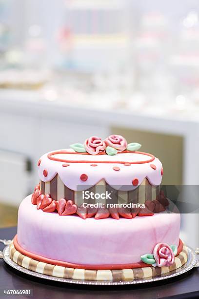 Wedding Cake Decorated With Pink Rose Flowers And Hearts Stock Photo - Download Image Now