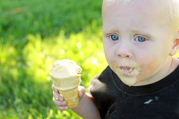 istock Cute Baby Eating Ice Cream Cone 467067441
