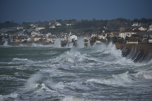 Telephoto image of Winter seas pounding the promenade.