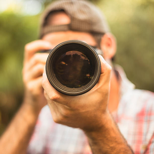 istock Photographer taking a picture with long lens 467068821