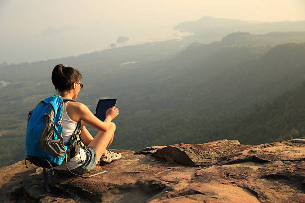 istock hiking woman use digital tablet on mountain peak 467069064