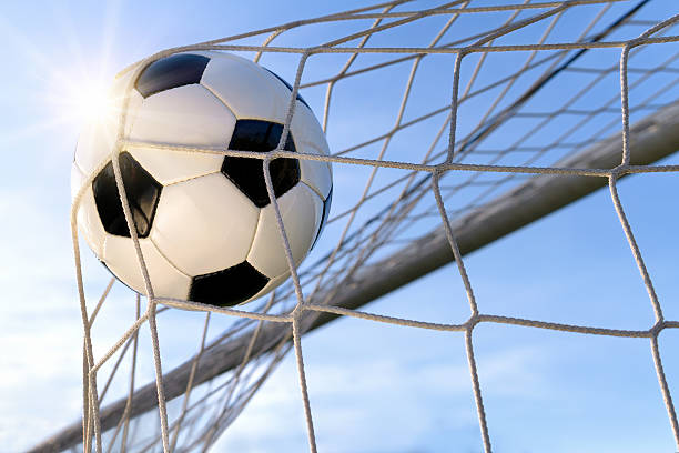 istock Football Goal, with sun and blue sky 467069088