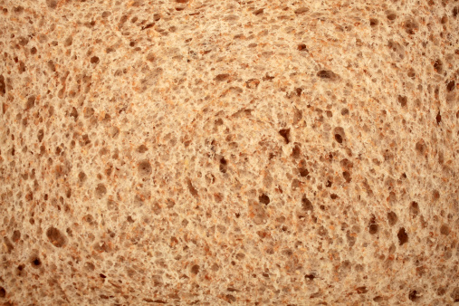 Slice brown bread close up background