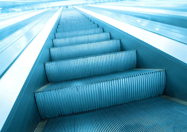 istock steps of escalator in business center 467072937