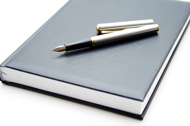 istock Ballpoint pen on telephone book 467074451