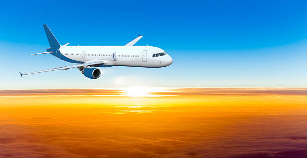 istock Airplane in the sky at sunset. 467076761