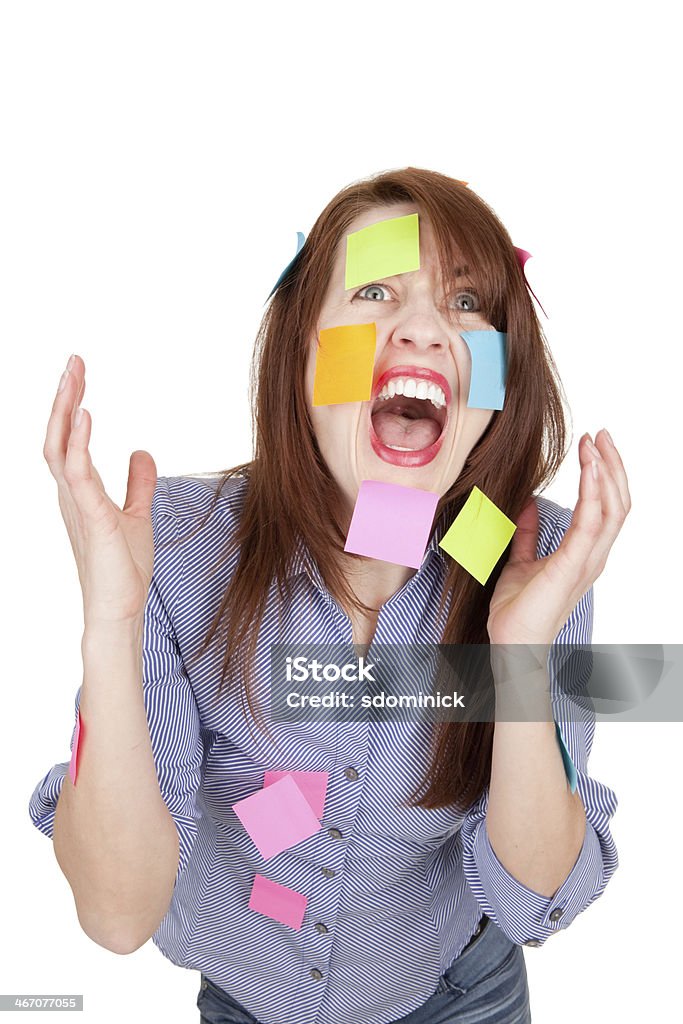 Stressed Screaming Woman With Sticky Notes All Over Her A stressed woman who is screaming and has sticky notes all over her. 35-39 Years Stock Photo