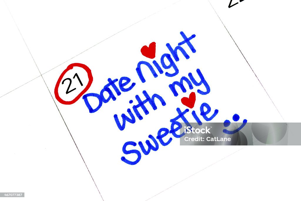 Date Night Handwritten on Calendar Calendar with handwritten reminder for Date Night Calendar Stock Photo