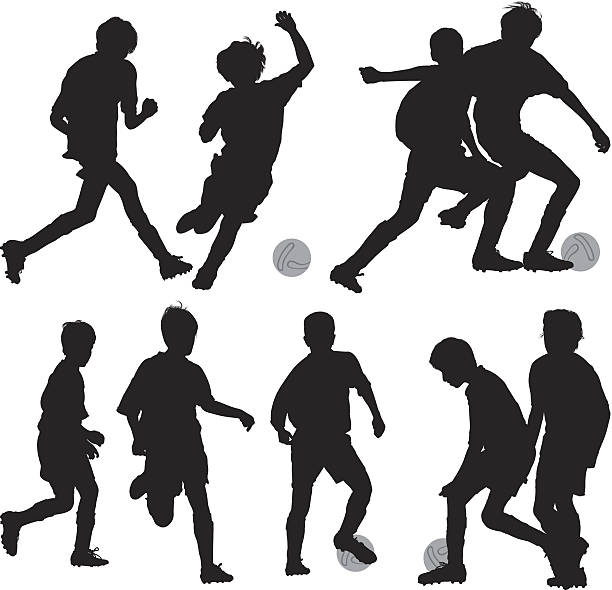 silhouette der kinder spielen fußball - soccer player soccer sport people stock-grafiken, -clipart, -cartoons und -symbole