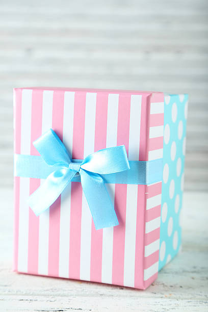 istock Beautiful gift box on white wooden background 467081120