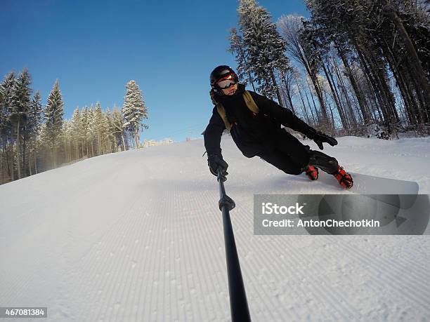 Snowboarder On The Slope Stock Photo - Download Image Now - 2015, Activity, Adult